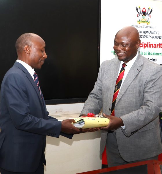 Incoming Deputy Principal CHUSS, Prof. Eddy Joshua Walakira (L) receives one of the Office files from outgoing counterpart Assoc. Prof. Eric Awich Ochen at the handover ceremony on 14th September 2026. Official Handover of Office of Deputy Principal, College of Humanities and Social Sciences (CHUSS), from Associate Prof. Eric Awich Ochen to Prof. Eddy Joshua Walakira, 14th September 2026, CHUSS Smart Room, Makerere University, Kampala Uganda, East Africa.