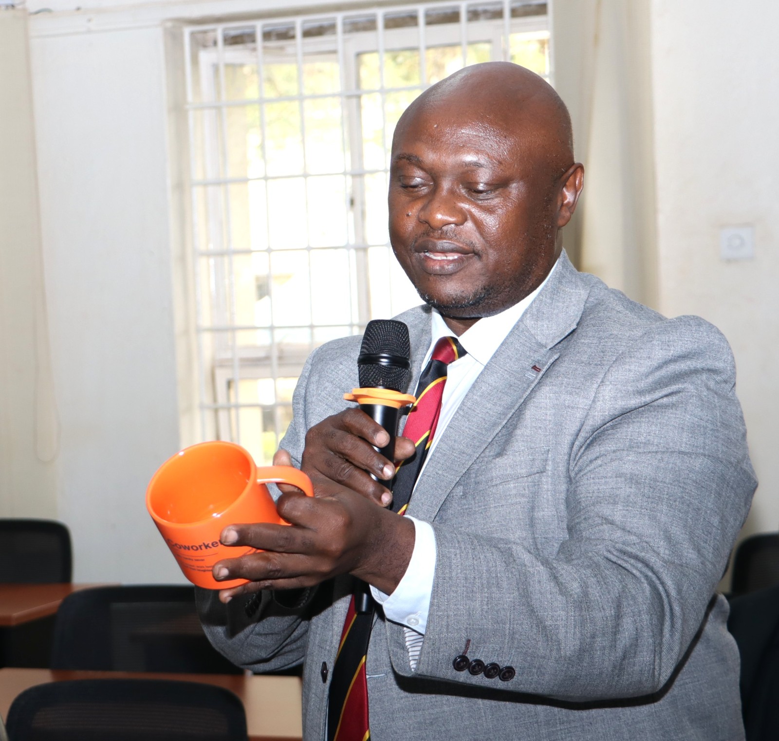 Prof. Eric Awich unveils the gift from the Principal. Official Handover of Office of Deputy Principal, College of Humanities and Social Sciences (CHUSS), from Associate Prof. Eric Awich Ochen to Prof. Eddy Joshua Walakira, 14th September 2026, CHUSS Smart Room, Makerere University, Kampala Uganda, East Africa.