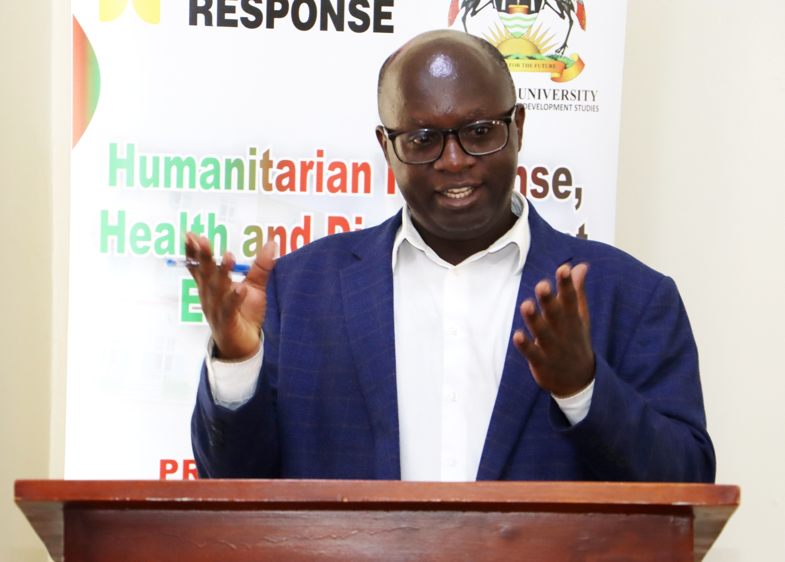 Dr. Justus Twesigye making closing remarks. Welcoming 17 students from 16 countries (Canada, Cape Verde, Uganda, Spain, Sierra Leone, South Sudan, Colombia, South Korea, The Gambia, India, Nepal, Kenya, Pakistan, Myanmar, Bangladesh and Malaysia) under the Erasmus+ funded Master of Humanitarian Response, Health and Displacement (Human Response) programme to study humanitarian crises, displacement, health, migration and development, 7th September 2026, School of Social Sciences Smart Room, College of Humanities and Social Sciences (CHUSS), Makerere University, Kampala Uganda, East Africa.
