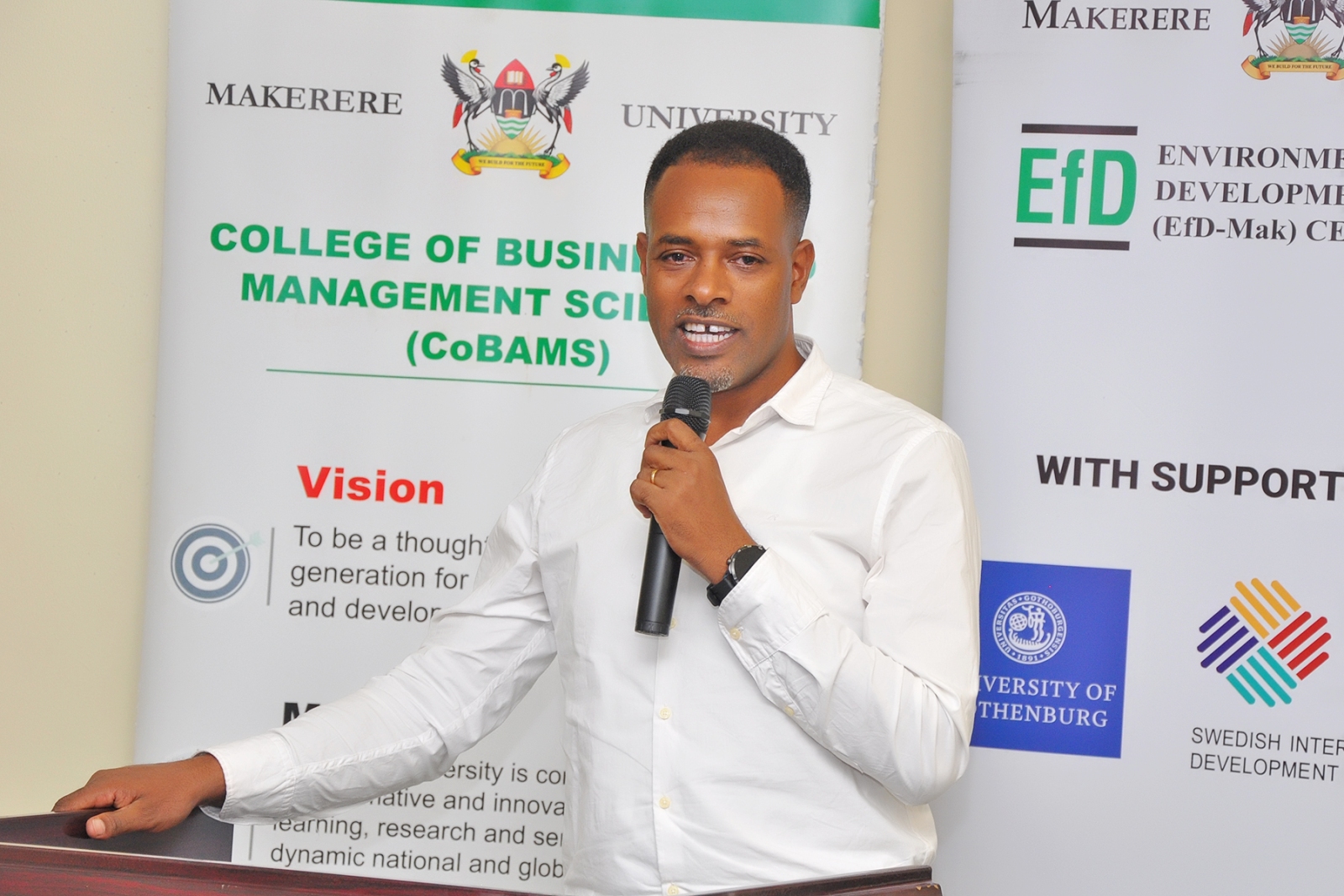 Dr. Gemeda O. Akuma delivering his heartfelt appreciation speech. College of Business and Management Sciences (CoBAMS) Environment for Development Initiative (EfD at Mak Centre) farewell to celebrate the outstanding contributions of Dr Gemeda Olani Akuma from the University of Cape Town, South Africa conclusion of his postdoctoral fellowship (July 2025 to September 2026), 2nd September 2026, Yusuf Lule Central Teaching Facility, Makerere University, Kampala Uganda, East Africa.