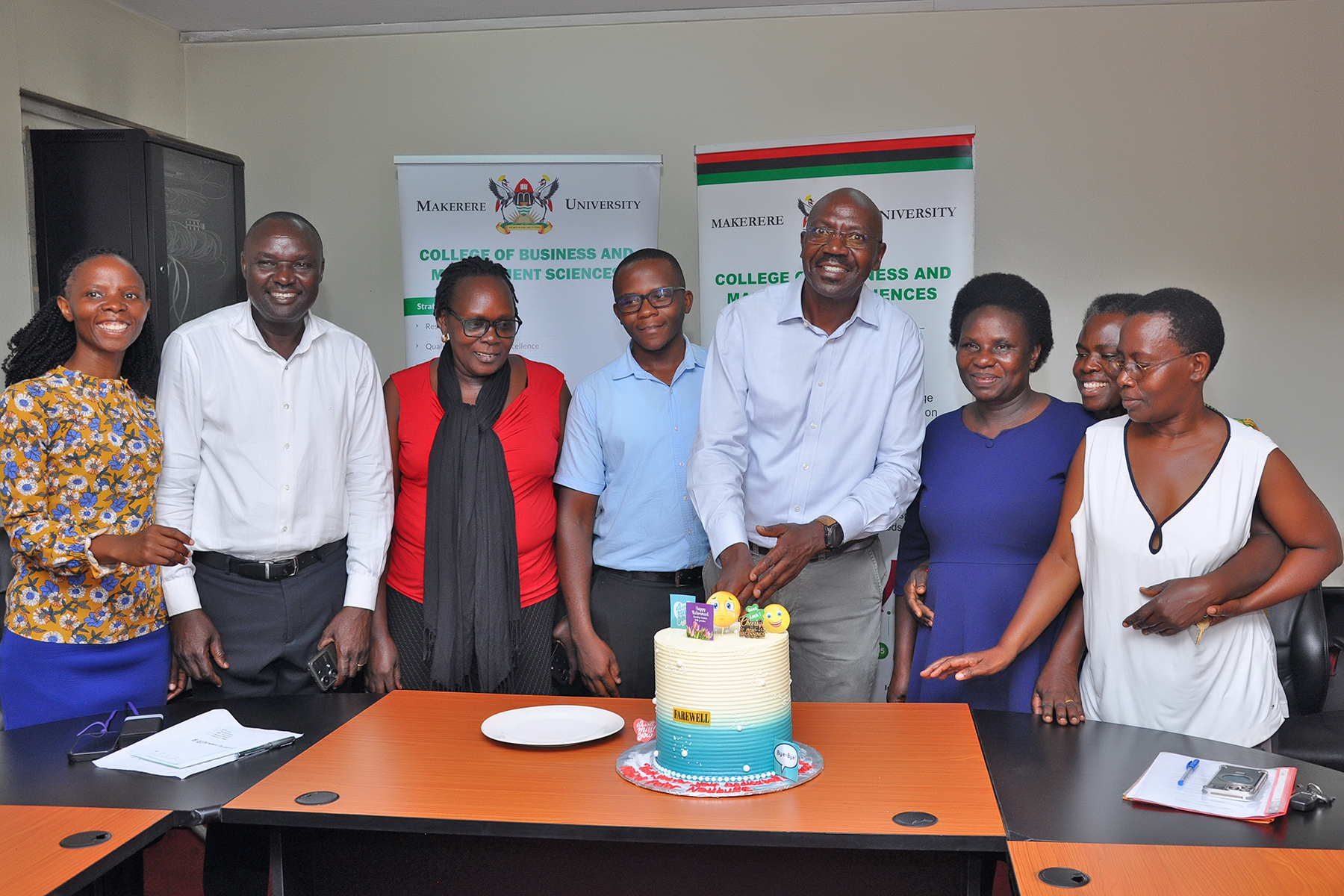 Staff directly overseen by the outgoing CoBAMS Bursar pose together for a photo session during the handover. Mr. Peter Mubiru handover of the office of the College Bursar to Mr. George Lusiba, 31st August 2026, College of Business and Management Sciences (CoBAMS), Makerere University, Kampala Uganda, East Africa.