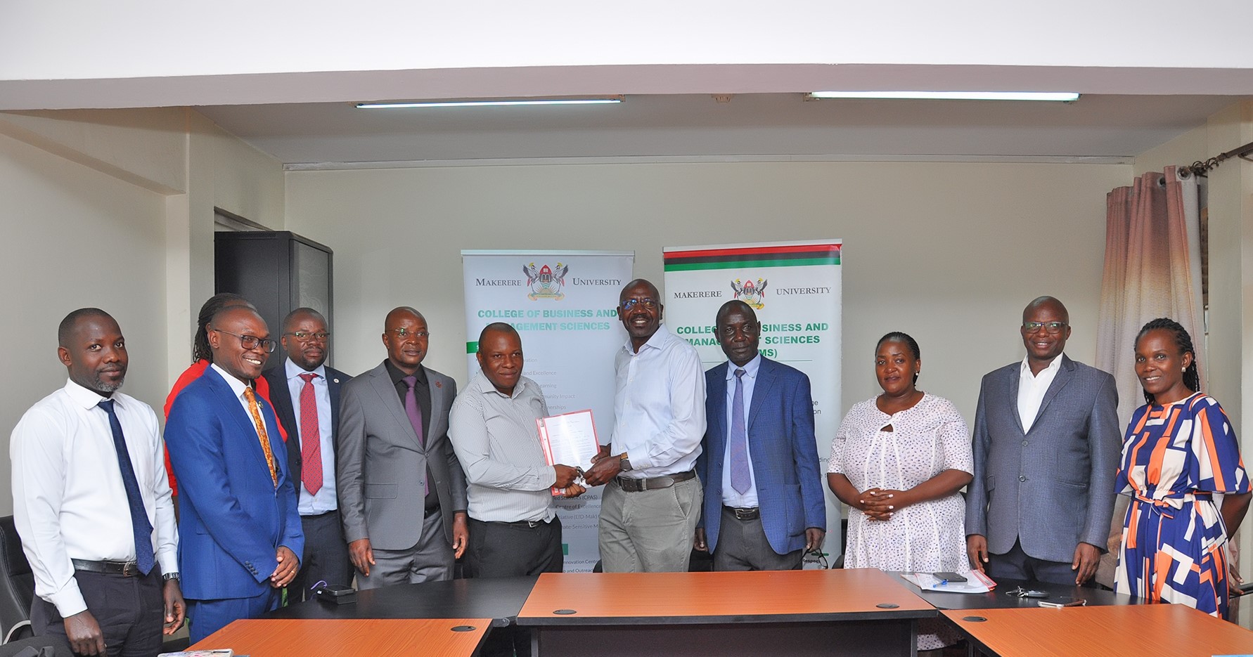 CoBAMS Management and Staff witness as join the Outgoing College Bursar-Mr. Peter Mubiru officially hands over to Mr. George Lusiba on 31st August 2026. Mr. Peter Mubiru handover of the office of the College Bursar to Mr. George Lusiba, 31st August 2026, College of Business and Management Sciences (CoBAMS), Makerere University, Kampala Uganda, East Africa.
