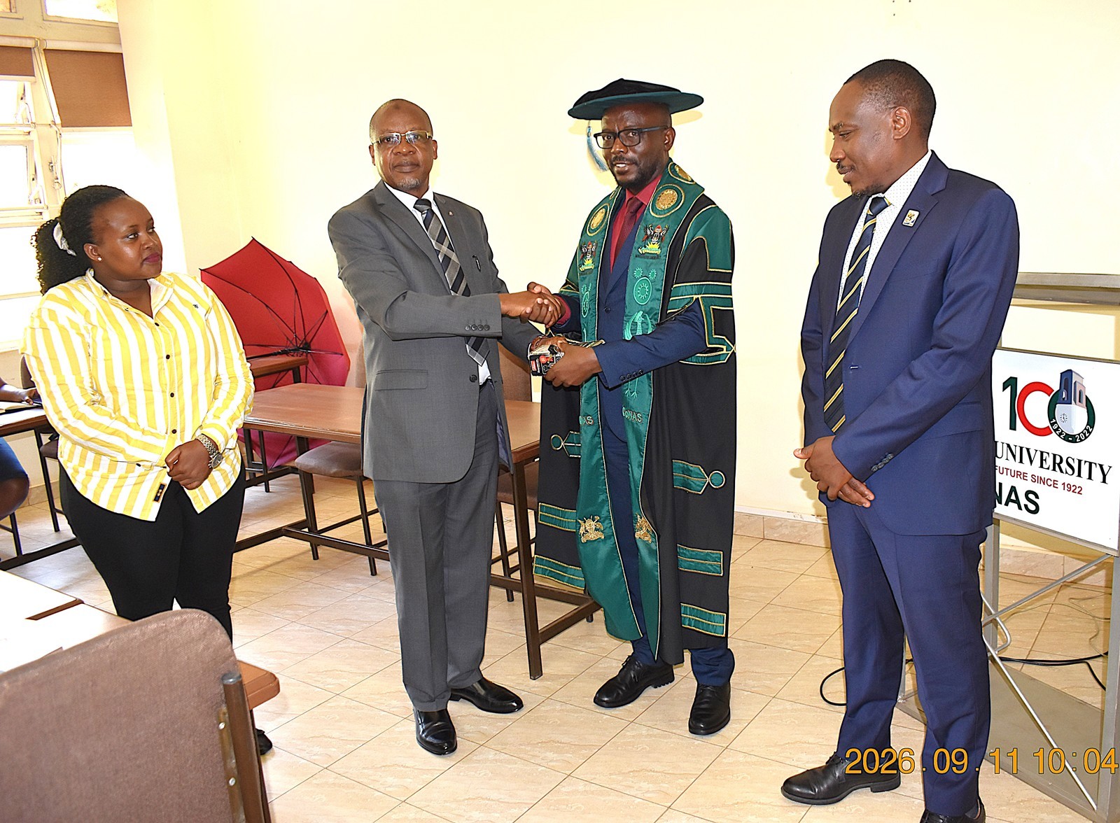 Prof. Juma Kasozi (2nd R) hands over the office keys and stamp to Prof. Godwin Kakuba. On the right is the Principal of CoNAS, Prof. Winston Tumps Ireeta, and on the left is Ms. Winnie Mbabazi from the Directorate of Internal Audit. Prof. Juma Kasozi formally hands over the office of Deputy Principal, College of Natural Sciences (CoNAS) to Prof. Godwin Kakuba, 11th September 2026, Makerere University, Kampala Uganda, East Africa.