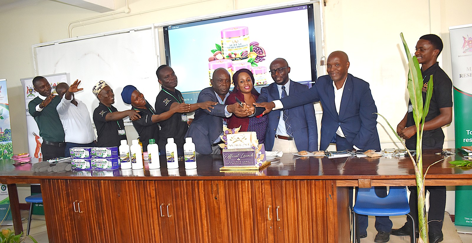 Cutting cake in celebration of the achievements. Research Dissemination for Government of Uganda through Makerere University Research and Innovations Fund (Mak-RIF)-funded project, titled “From World’s Worst Water Weed to Worth: Small-scale Community Bio-refining of Water Hyacinth to Produce Value-added Commercially Valuable Products,” by Dr. Alice Nabatanzi, Department of Plant Sciences, Microbiology and Biotechnology, College of Natural Sciences (CoNAS), Botany Lab 2, 22nd September 2026, Kampala Uganda, East Africa.