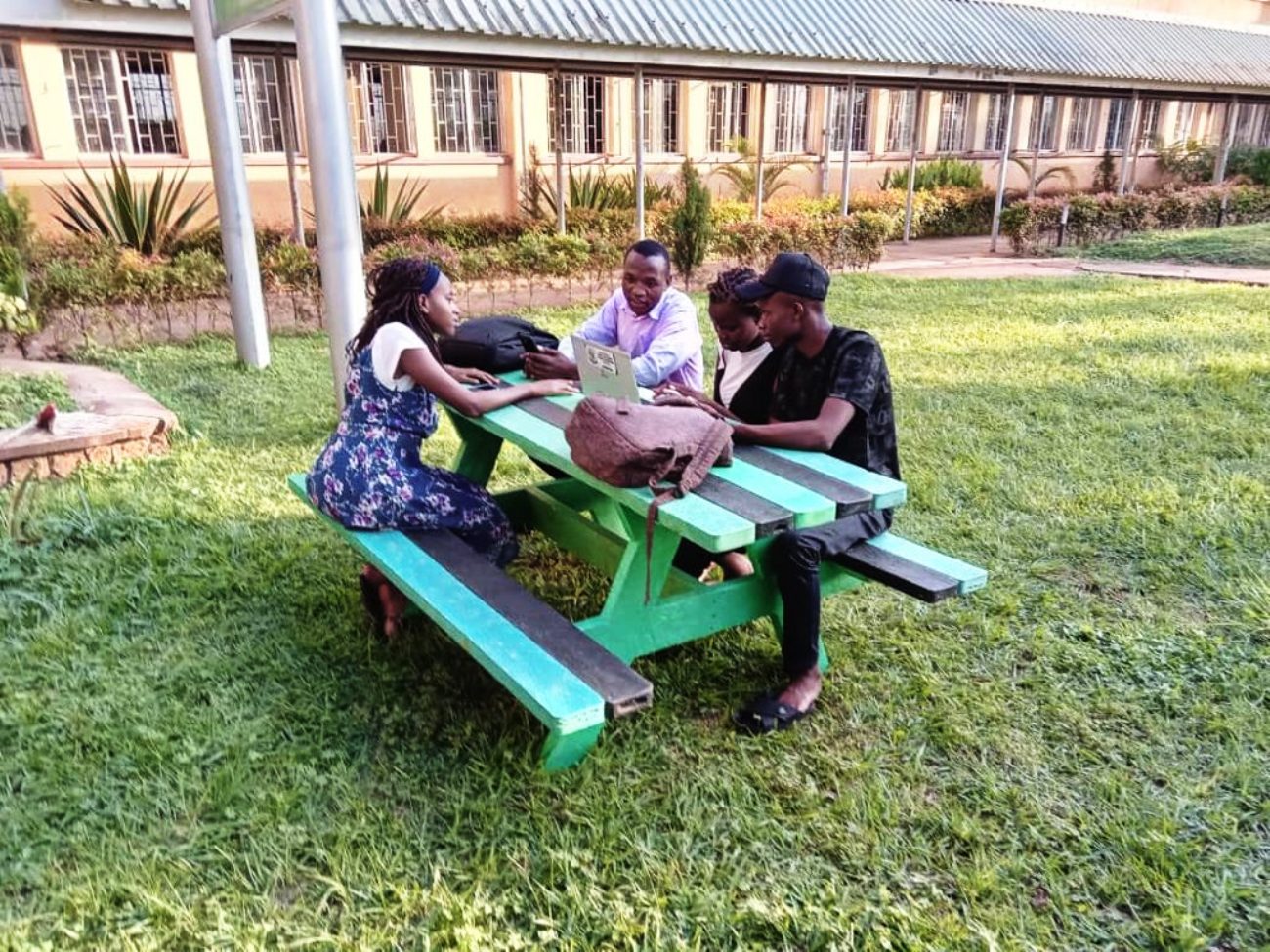 Students from the Department of Plant Sciences, Microbiology and Biotechnology using the table for their revision. WastePlus Ltd, a waste management and recycling enterprise founded by BSc Conservation Biology from the Department of Plant Sciences, Microbiology and Biotechnology, School of Physical Sciences donation of furniture made from recycled plastic, August 2026, Science Quadrangle, College of Natural Sciences (CoNAS), Makerere University, Kampala Uganda, East Africa.