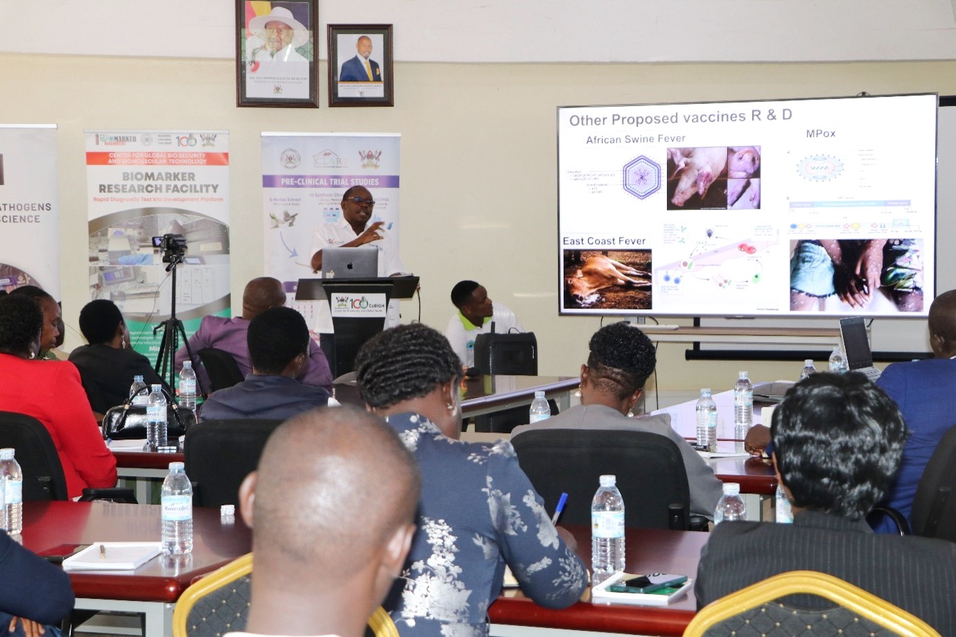 The Director of the Centre for Global Biosecurity and Biomolecular Technology (CeBIOTECH), Prof. Enock Matovu, presents the ventures operating at the Centre during a meeting with the Parliamentary Committee on Science, Technology, and Innovation on 31st August 2026. Parliamentary Committee on Science, Technology, and Innovation visits the Centre for Global Biosecurity and Biomolecular Technology (CeBIOTECH) to assess the progress of ventures supported under the Science, Technology and Innovation–Office of the President (STI-OP) and answer How can Uganda turn investments in scientific research into practical technologies, enterprises, and solutions that respond to national development challenges? 31st August 2026, College of Veterinary Medicine, Animal Resources and Biosecurity (CoVAB), Makerere University, Kampala Uganda, East Africa.