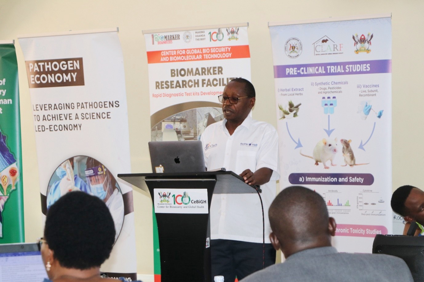 The Director of the Centre for Global Biosecurity and Biomolecular Technology (CeBIOTECH), Prof. Enock Matovu, presents the ventures operating at the Centre during a meeting with the Parliamentary Committee on Science, Technology, and Innovation on 31st August 2026. Parliamentary Committee on Science, Technology, and Innovation visits the Centre for Global Biosecurity and Biomolecular Technology (CeBIOTECH) to assess the progress of ventures supported under the Science, Technology and Innovation–Office of the President (STI-OP) and answer How can Uganda turn investments in scientific research into practical technologies, enterprises, and solutions that respond to national development challenges? 31st August 2026, College of Veterinary Medicine, Animal Resources and Biosecurity (CoVAB), Makerere University, Kampala Uganda, East Africa.