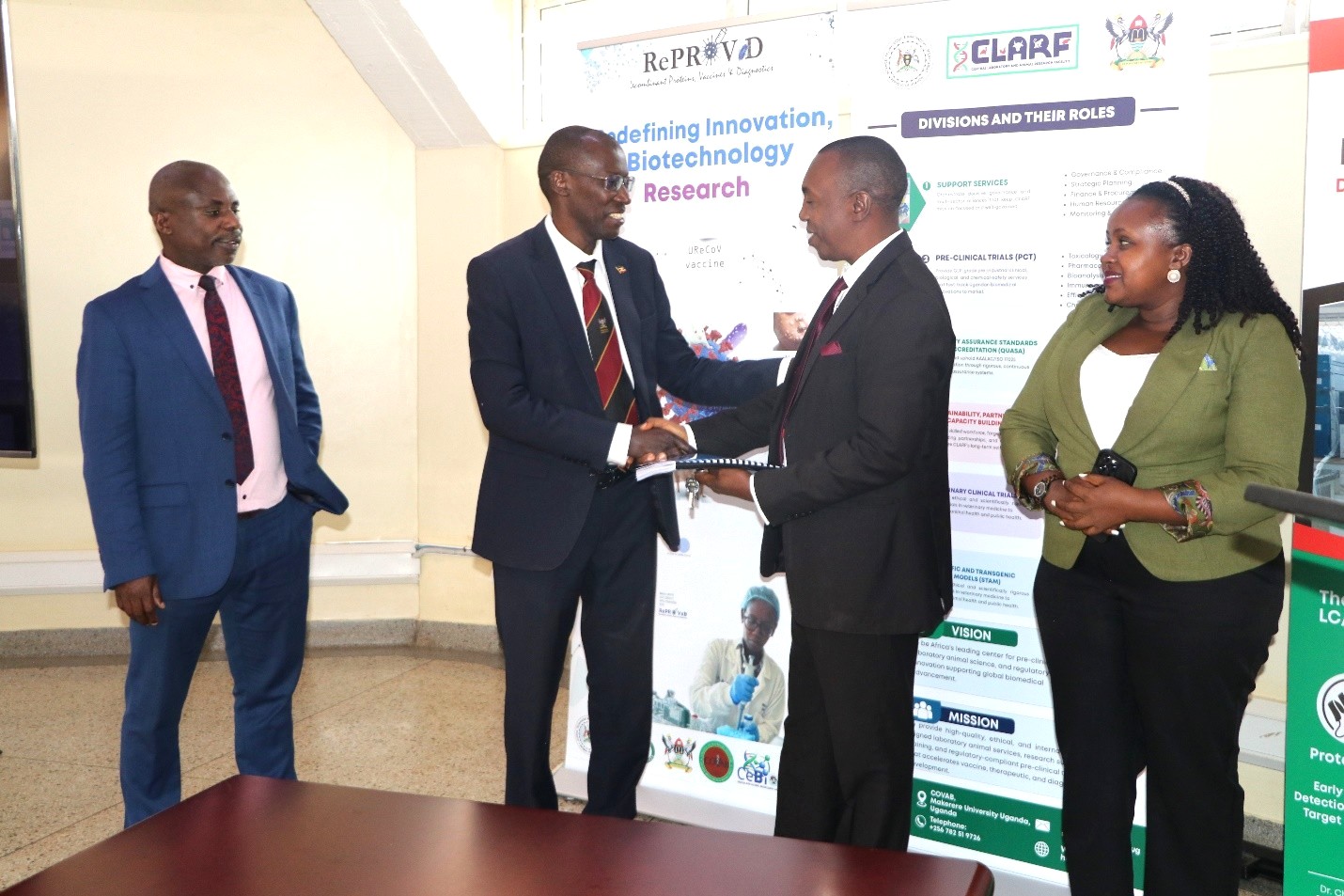 Mr. Deus Mujuni, Prof. Mwiine, outgoing Principal, Prof. Kankya, incoming Principal, and Ms. Winnie Mbabazi from Audit. Prof. Clovice Kankya officially assumes leadership of College of Veterinary Medicine, Animal Resources and Biosecurity (CoVAB) from outgoing Principal Prof. Frank Norbert Mwiine, 17th September 2026, Makerere University, Kampala Uganda, East Africa.