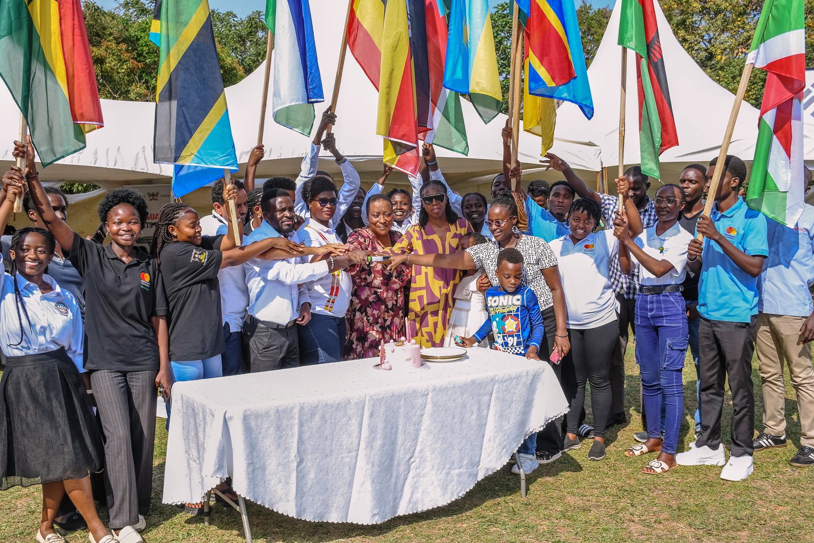 Scholars and officials cutting cake to celebrate the day. Community Open Day for Mastercard Foundation Initiatives at Makerere University, where Prof. Claire Mack Mugasa represented the Deputy Vice Chancellor (Academic Affairs) Prof. Sarah Ssali as Guest of Honour, 5th September 2026, Freedom Square, Kampala Uganda, East Africa.
