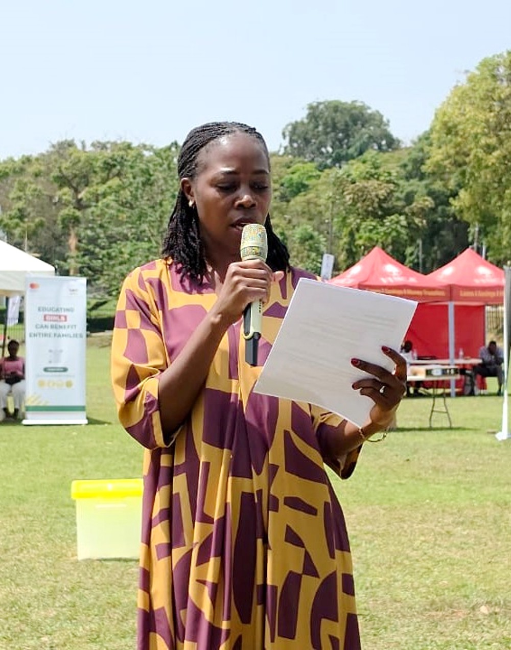 Ms. Maria Mugerwa, the representative of Mastercard Foundation speaking at the event. Community Open Day for Mastercard Foundation Initiatives at Makerere University, where Prof. Claire Mack Mugasa represented the Deputy Vice Chancellor (Academic Affairs) Prof. Sarah Ssali as Guest of Honour, 5th September 2026, Freedom Square, Kampala Uganda, East Africa.