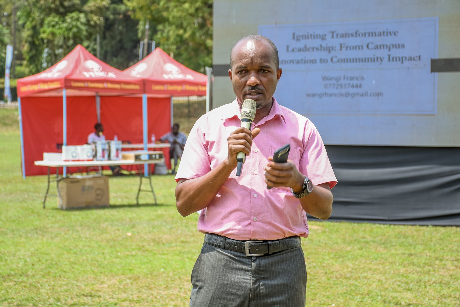 Rotarian Francis Wangi, the Keynote Speaker, delivering his address at the event. Community Open Day for Mastercard Foundation Initiatives at Makerere University, where Prof. Claire Mack Mugasa represented the Deputy Vice Chancellor (Academic Affairs) Prof. Sarah Ssali as Guest of Honour, 5th September 2026, Freedom Square, Kampala Uganda, East Africa.