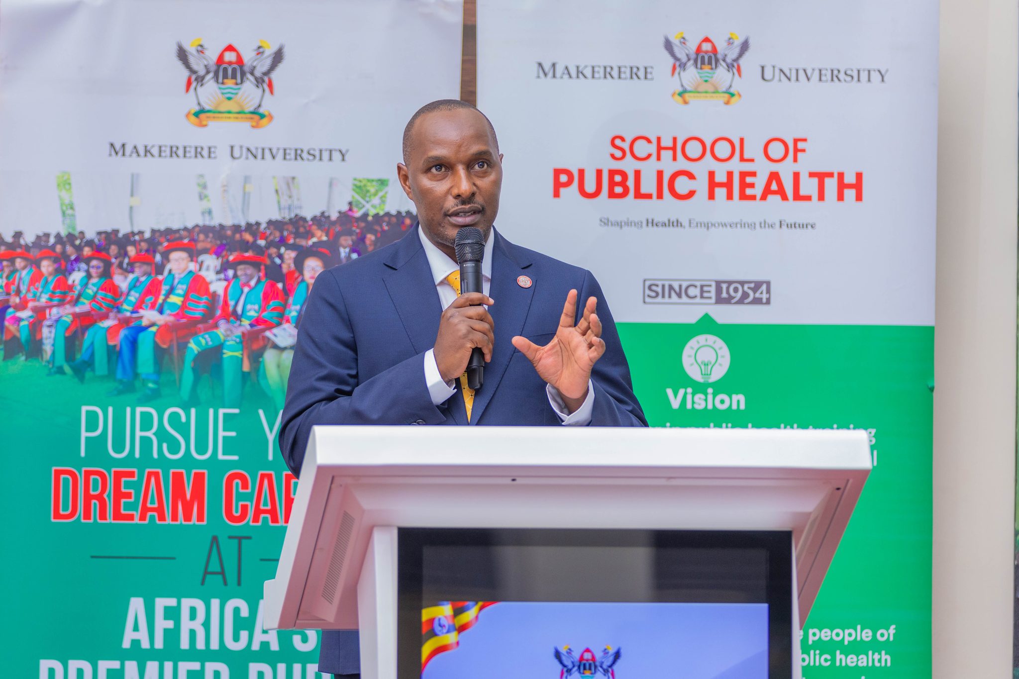 Hon. Eng. Jonard Asiimwe Akiiki delivers remarks during his visit to MakSPH on 16 September 2026, calling for stronger systems to move university research into wider use. Hon. Eng. Jonard Asiimwe Akiiki, Minister of Science, Technology and Innovation in the Office of the President, Day 3 of Ministerial Maiden Visit to Makerere University, 16th September 2026, Kampala Uganda, East Africa.