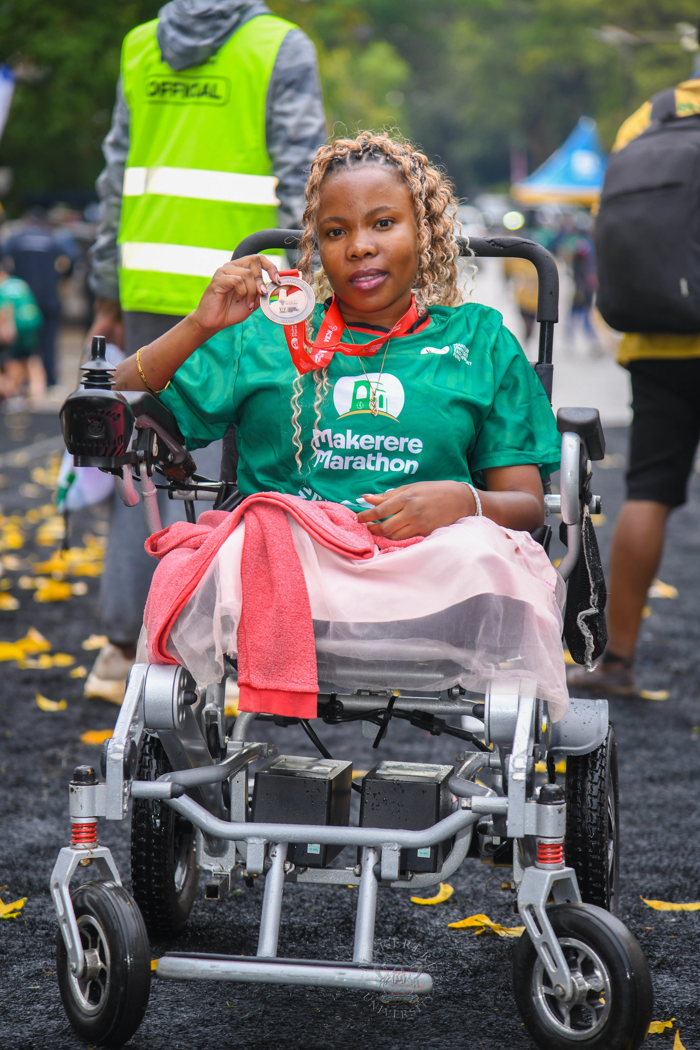Ms. Nalumansi Sharon shows off her medal. 6th Edition of the Makerere Marathon with Chief Runner as the Speaker of Parliament Rt. Hon. Jacob Marksons Oboth, 27th September 2026, Makerere University, Kampala Uganda, East Africa.