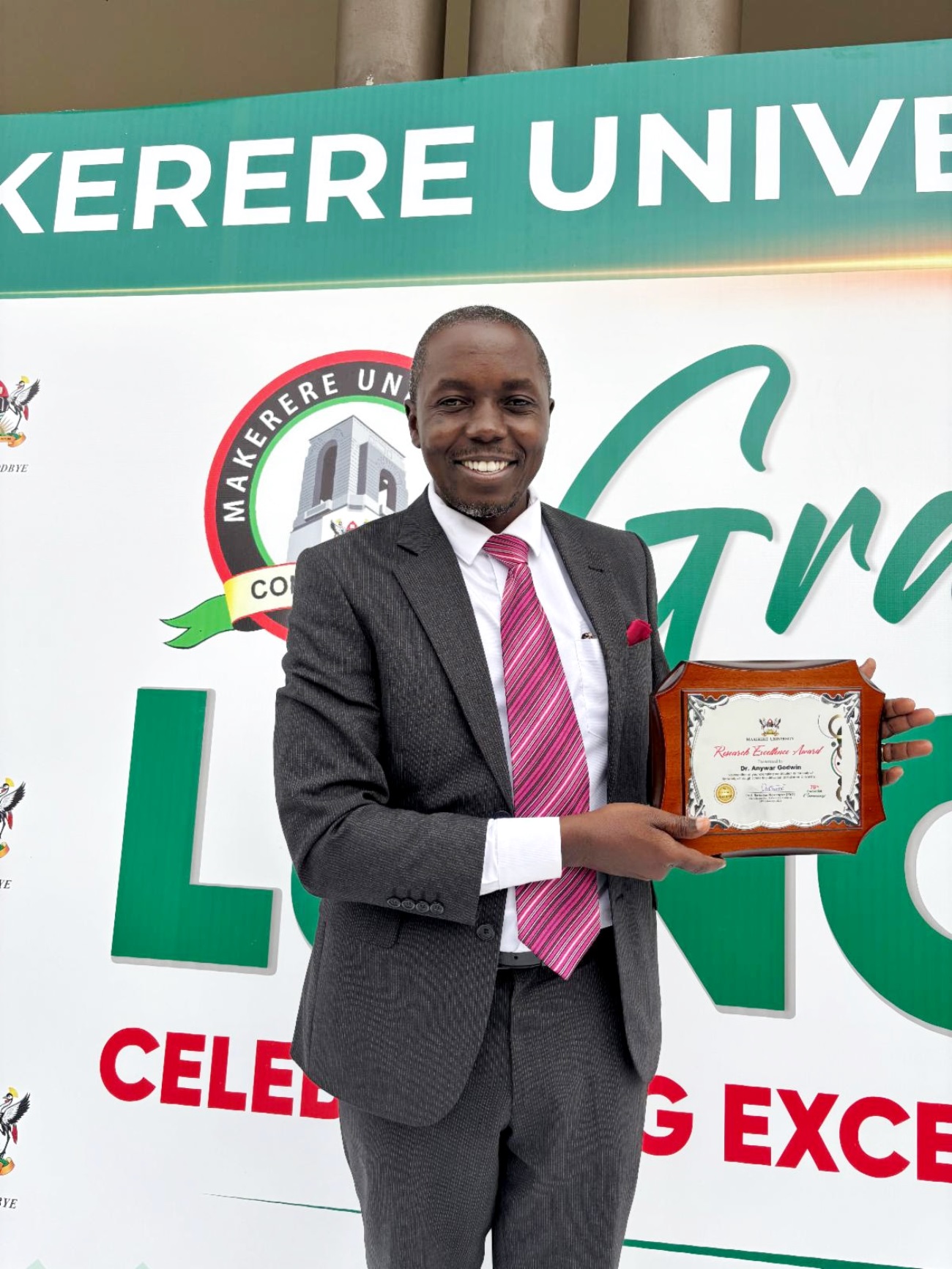 Dr. Godwin Anywar poses with his VC Research Excellence Award during the 76th Graduation Ceremony. Photo: CARTA, Makerere University, Kampala Uganda, East Africa
