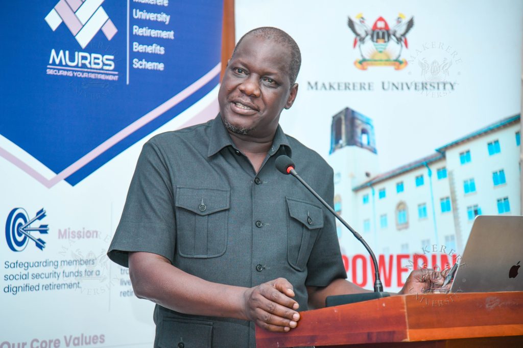 Hon. Daniel Fred Kidega delivering remarks from the Chairperson, Makerere University Council.