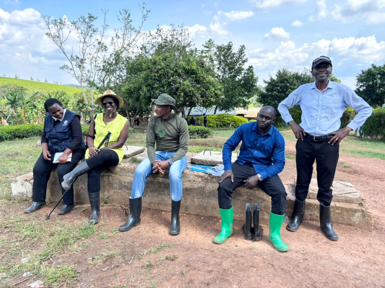 PARI Xlll students (Seated) with Dr. Richard Miiro (R) at Mwera tea estate, Mityana District after their second transect walk in October 2026. PhD in Agricultural and Rural Innovation XIII, Department of Extension and Innovation Studies, College of Agricultural and Environmental Sciences (CAES), Makerere University Field Course, 4th-16th Oct 2026, Mwera Parish, Mityana District, Uganda, East Africa.