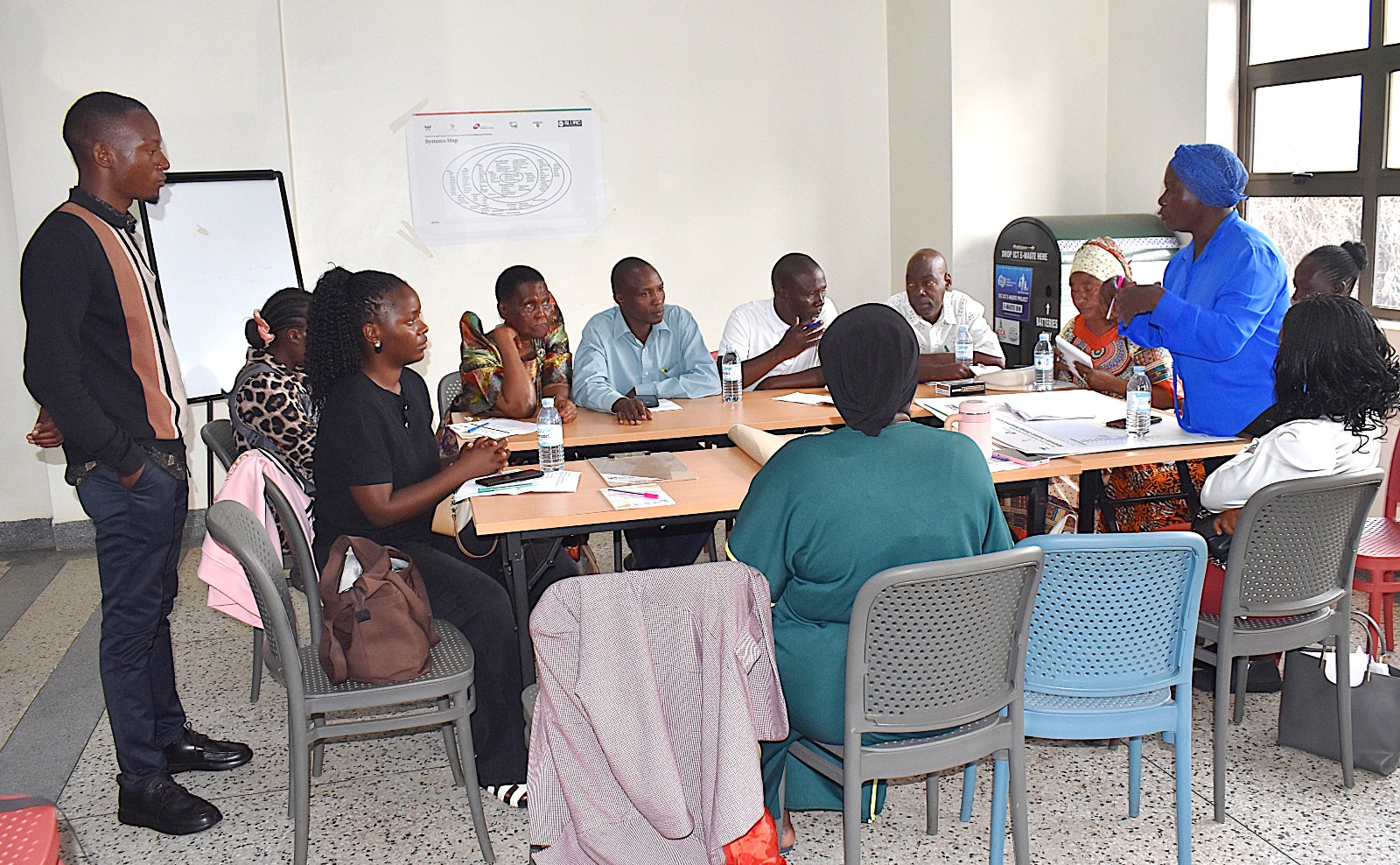 Some of the participants during the mapping exercise. Urban Action Lab community-level systems-mapping workshop to develop a shared understanding of how solid waste, drainage, flooding, climate vulnerability, health, and livelihoods interact within Kampala’s informal settlements 1st October 2026, School of Public Health Auditorium, Makerere University, Kampala Uganda, East Africa.