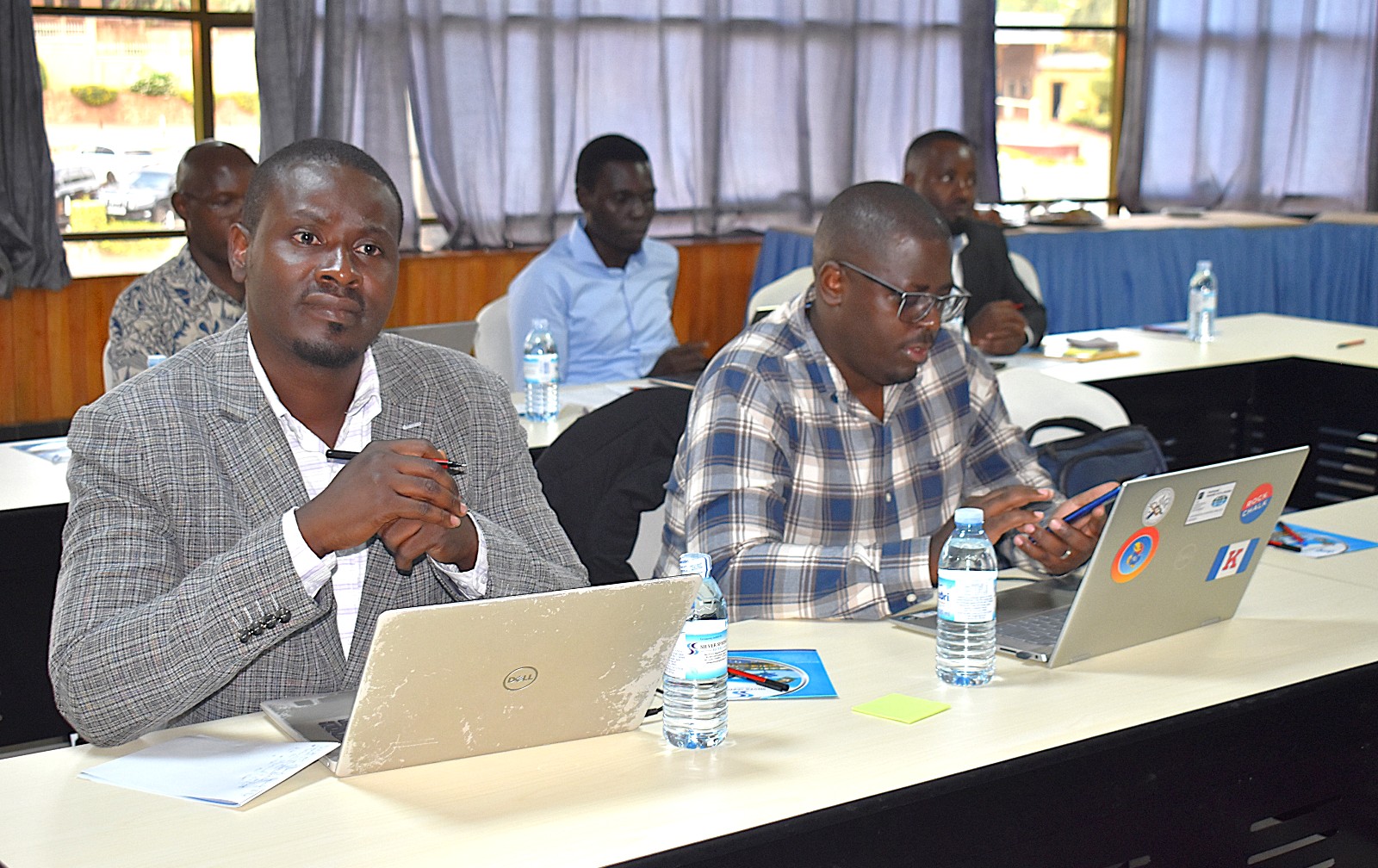 Dr. Ivan Ssewanyaga Mukiibi (L), Mining Industry Liaison and Skills Mapping Lead on the project, with Mr. Hillary Mwongyera from the Department of Geology and Petroleum Studies at Makerere University. Department of Geology and Petroleum Studies, College of Natural Sciences, Makerere University stakeholder workshop to get input on the review of its Geology curricula and the development of industry-aligned short courses supported by the Government of the Federal Republic of Germany and the European Union through Deutsche Gesellschaft für Internationale Zusammenarbeit (GIZ), 6th October 2026 at Silver Springs Hotel, Bugolobi, Kampala, Uganda, East Africa.