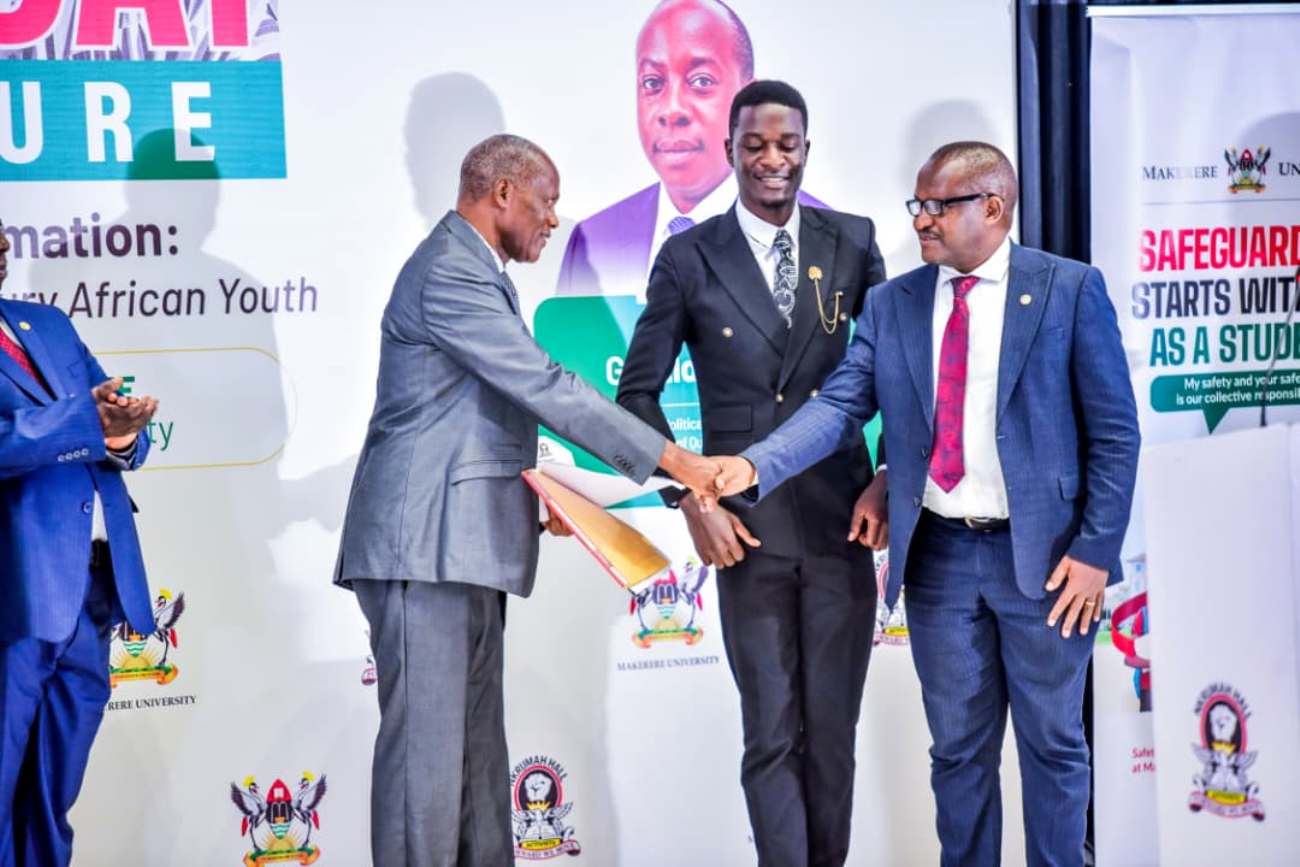 Mr. John Kamya (L) receives his appreciation award from Dr. Charles Kahigiriza (R) and Joseph Sekabira (C). Nkrumah Day and Public Lecture organised by Nkrumah Hall under the theme “Leadership, Self-Reliance and Transformation: Reimagining Nkrumah's Vision for the 21st Century African Youth,” 8th October 2026, Yusuf Lule Central Teaching Facility Auditorium, Makerere University, Kampala Uganda, East Africa.