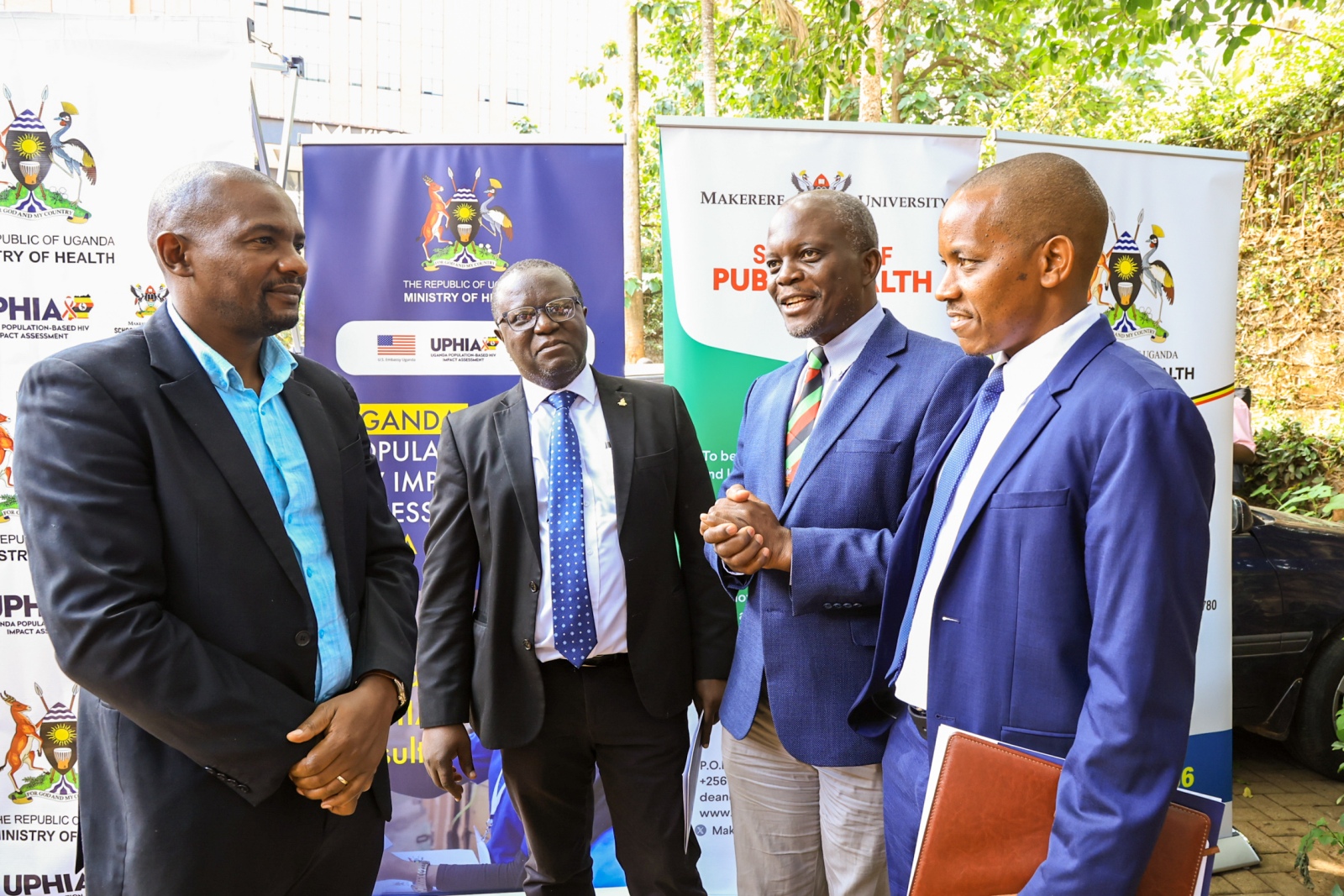 MakSPH researchers, including UPHIA 2025 Activity Lead Prof. Frederick Makumbi and Project Director Dr. Sam Biraro, converse at the preliminary results release, Uganda Media Centre, 1 October 2026. Release of preliminary findings of the 2025 Uganda Population-Based HIV Impact Assessment (UPHIA 2025), a national household survey that provides a current picture of the country’s HIV response and selected non-communicable disease indicators, Ministry of Health-overall leadership, Makerere University School of Public Health (MakSPH)-prime implementing organisation, working with UVRI, UBOS, regional referral hospitals and local governments. Funded by PEPFAR through the U.S. CDC, 1st October 2026, Uganda Media Centre, Kampala Uganda, East Africa.