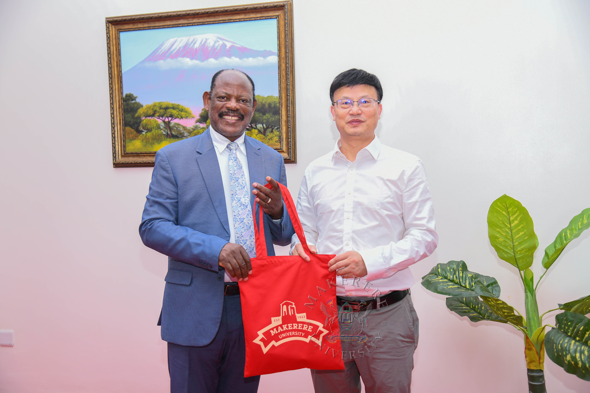 Prof. Barnabas Nawangwe (L) presents an assortment of Makerere Souvenirs to Prof. Dingyu Ou (R). Visit by a delegation from Xiangtan University headed by Professor Dingyu Ou, in company of Mr. Tang Fei and Professor Gilbert Gumshabe, the Chinese and Ugandan Directors of the Confucius Institute at Makerere University respectively, to update 20-year academic partnership, with new focus on joint Master's degree program in Chemical Engineering 12th October 2026, French Embassy, Kampala Uganda, East Africa.