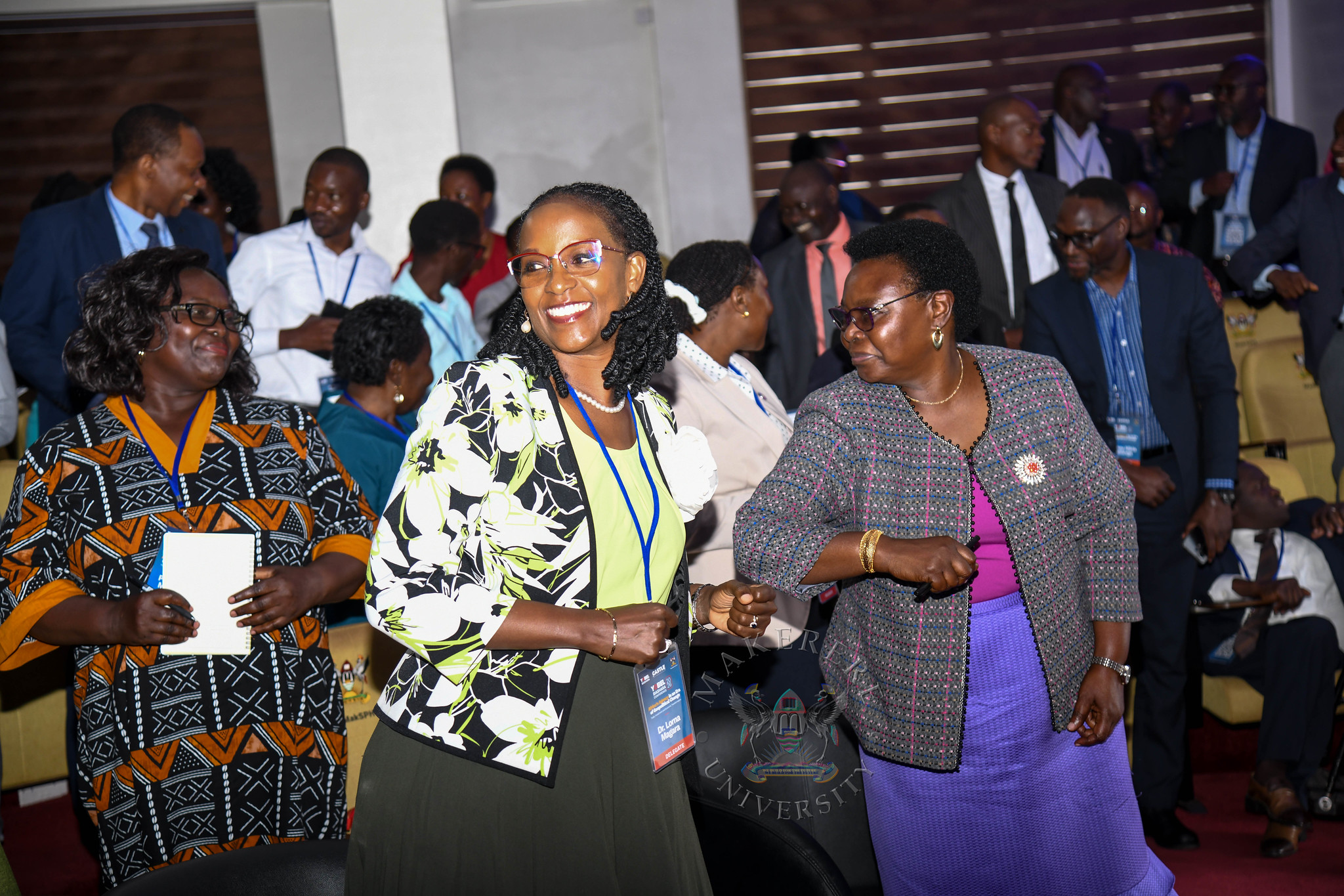 Dr. Lorna Magara shares a light moment with other dignitaries during the Conference. YOBEL Biashara Conference 2026, theme: Africa's Agency in an Era of Geopolitical Change-Trade, Investment and Economic Transformation, Makerere University School of Public Health Auditorium, 30th September 2026, Makerere University, Kampala Uganda, East Africa.