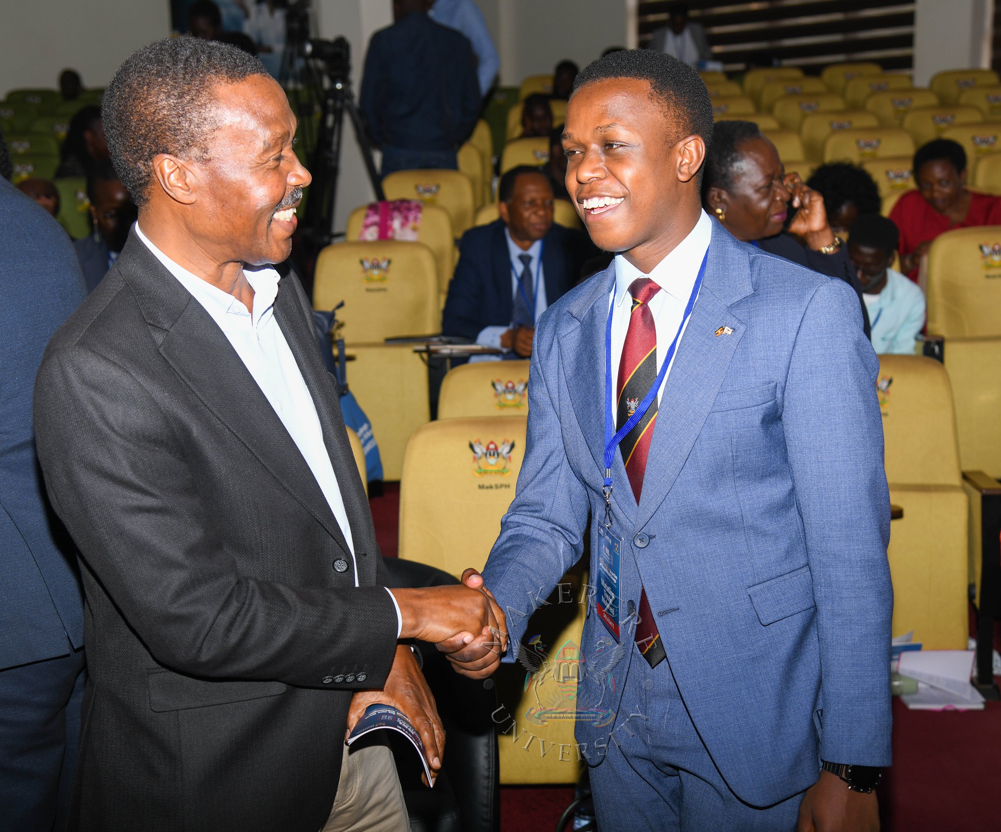 Maj, Gen, Gregory Mugisha Muntuyera (L) interacts with Guild Speaker Rt. Hon. Trevis Mutatiina Muhwezi (R). YOBEL Biashara Conference 2026, theme: Africa's Agency in an Era of Geopolitical Change-Trade, Investment and Economic Transformation, Makerere University School of Public Health Auditorium, 30th September 2026, Makerere University, Kampala Uganda, East Africa.