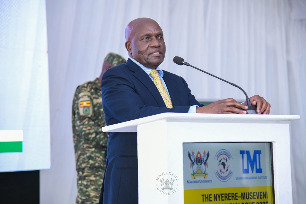 Rt. Hon. Dr. Crispus Walter Kiyonga delivering the President's message at the Symposium.