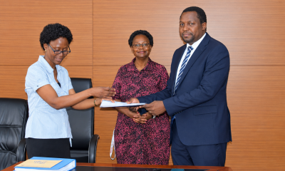 Outgoing Head of Department, Assoc. Prof. Robinah Kulabako (left), hands over the office to the incoming Head of Department, Dr. Philip Nyenje, during a ceremony held at CEDAT on October 5, 2026. In the centre is the Dean, School of Engineering, Assoc. Prof. Eng. Dorothy Okello