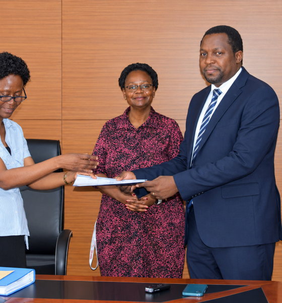 Outgoing Head of Department, Assoc. Prof. Robinah Kulabako (left), hands over the office to the incoming Head of Department, Dr. Philip Nyenje, during a ceremony held at CEDAT on October 5, 2026. In the centre is the Dean, School of Engineering, Assoc. Prof. Eng. Dorothy Okello