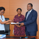 Outgoing Head of Department, Assoc. Prof. Robinah Kulabako (left), hands over the office to the incoming Head of Department, Dr. Philip Nyenje, during a ceremony held at CEDAT on October 5, 2026. In the centre is the Dean, School of Engineering, Assoc. Prof. Eng. Dorothy Okello
